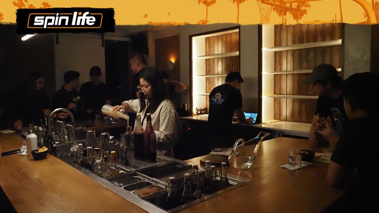 blank_space bar interior ambiance with people gathered around the bar counter